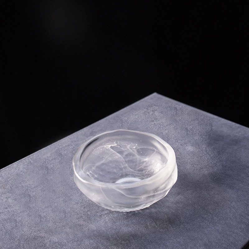 Teeservice aus transparentem Glas mit Teekanne und Teetasse